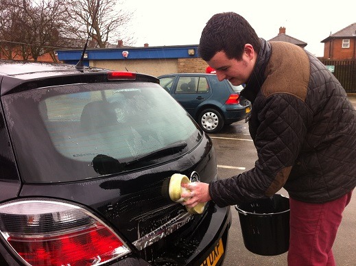 Student washing car