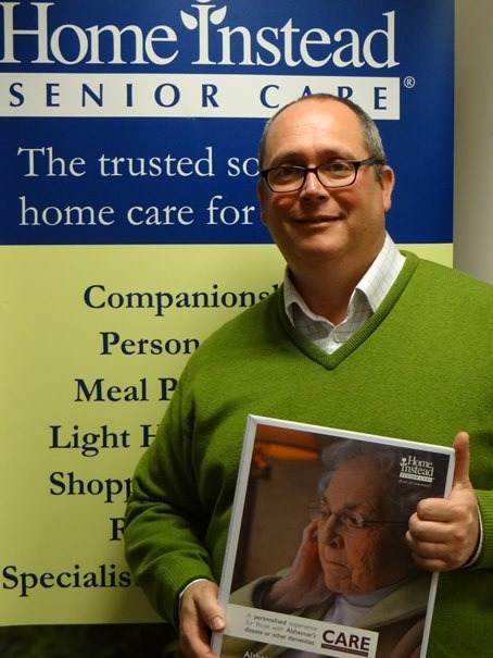 Andrew Van Parys with some of the Alzheimer’s training material used at the free family workshops