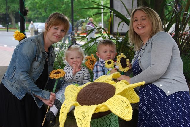 Yarn Bombers Claire Bowes and Natalie Taylor with Olivia and Hugo