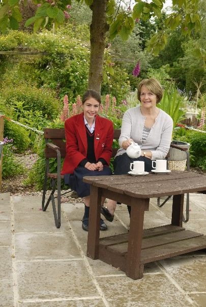 Chairman of the Trustees of Horticap, Joy Allan, with Belmont Grosvenor School charities prefect Sophie Jones, 11