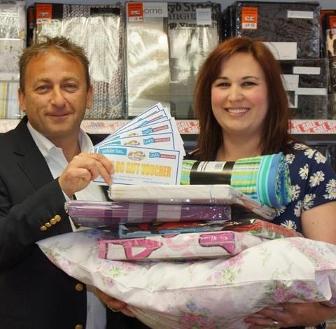 Bed Race Challenge Winner! The Yorkshire Linen Co managing director Ross Leventhal hands duvet challenge winner Sally Haslewood her prize