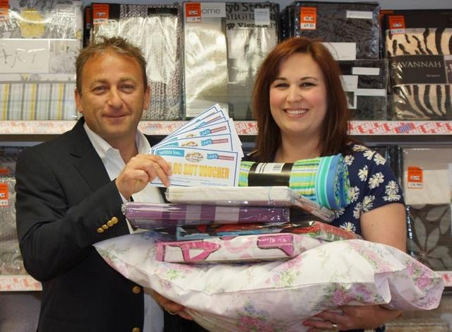 Bed Race Challenge Winner! The Yorkshire Linen Co managing director Ross Leventhal hands duvet challenge winner Sally Haslewood her prize