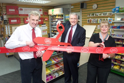 At Coldbath Road, Mr Jones (centre) cut the ribbon with Subpostmaster Trevor Spurgeon (left) and Sue Spurgeon (right).