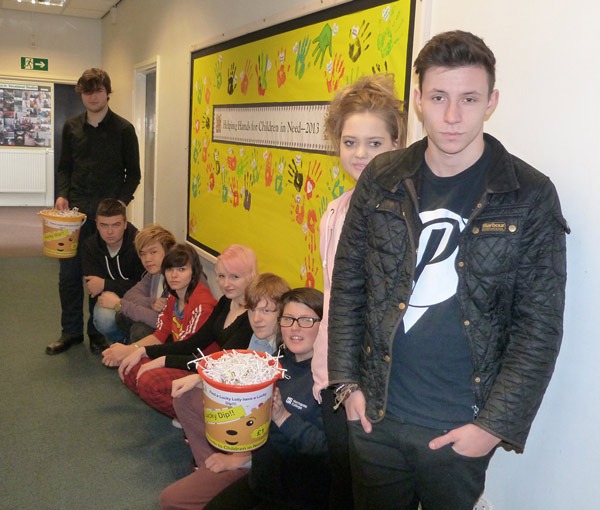Enterprise students outside the Children in Need noticeboard Enterprise students outside the Children in Need noticeboard