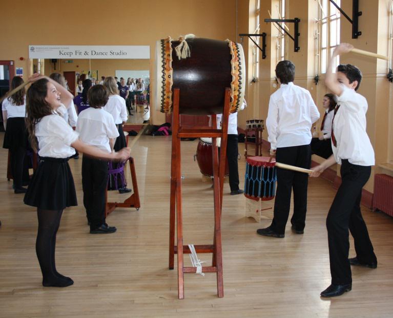 Year 8 students trying their hand at Taiko drumming