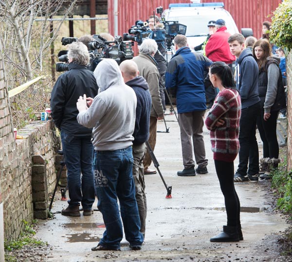 The incident also prompted a surprisingly large turnout by the national, with many poised with cameras at the building and transmitting live broadcasts.