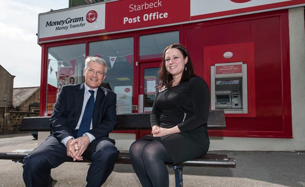 Andrew with postmistress Gemma Chowdhury outside the updated Post Office