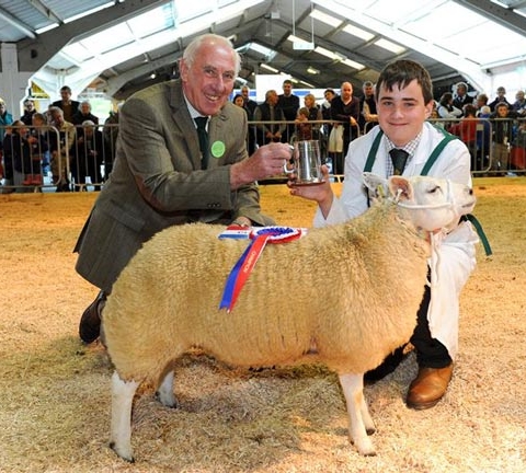 14 year old Richard Lancaster of Clitheroe, winner of the Sheep Young Handler Championship with steward Philip Hughes at Countryside Live 2014