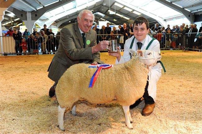 14 year old Richard Lancaster of Clitheroe, winner of the Sheep Young Handler Championship with steward Philip Hughes at Countryside Live 2014