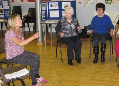 Carol Rowson from ‘Extend’ demonstrates chair-based activities to over 50s at the recent ‘Ageing Well’ event. Finding out about what’s available locally for people over 50