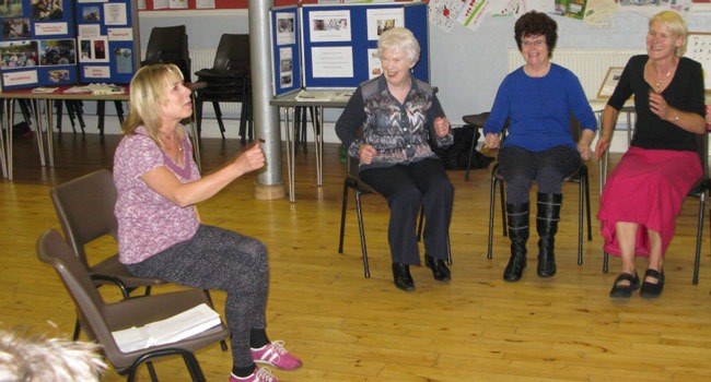 Carol Rowson from ‘Extend’ demonstrates chair-based activities to over 50s at the recent ‘Ageing Well’ event. Finding out about what’s available locally for people over 50