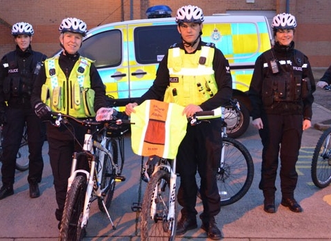North Yorkshire Police’s Cycle Response Team and Sgt Ray Milligan and PC Linsey Moore with the cycle lights and reflective back pack covers