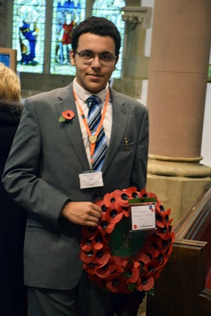 Head boy, Jamaal Mens with wreath