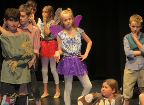 pupils from Belmont Grosvenor School on stage performing ‘A Midsummer Night’s Dream’