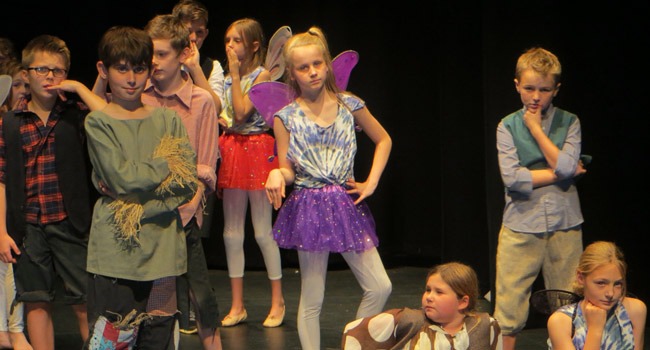 pupils from Belmont Grosvenor School on stage performing ‘A Midsummer Night’s Dream’