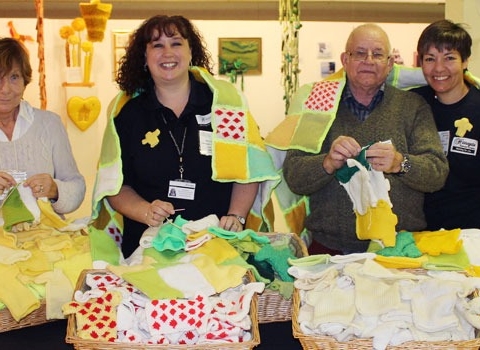 Left-Right: Volunteer knitter and stitcher Pam Oswin, Harrogate Borough Council’s Parks Development Officer Kate Dawson, Volunteer knitter and stitcher John Freer and Horticultural Officer Sue Wood.