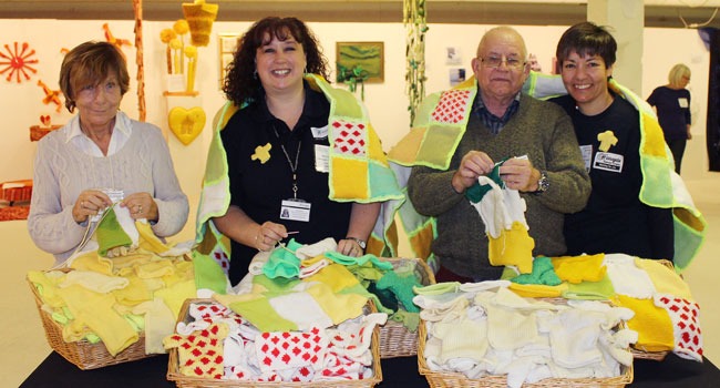 Left-Right: Volunteer knitter and stitcher Pam Oswin, Harrogate Borough Council’s Parks Development Officer Kate Dawson, Volunteer knitter and stitcher John Freer and Horticultural Officer Sue Wood.