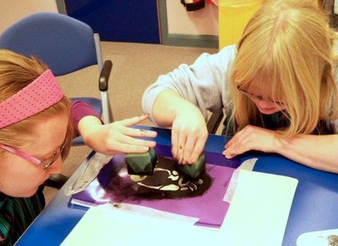 Students Victoria Moore (left) and Amy Astley hard at work on a new design