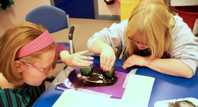 Students Victoria Moore (left) and Amy Astley hard at work on a new design