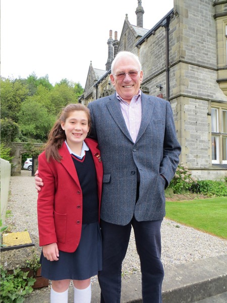 Belmont Grosvenor School pupil Mia Crosse with her grandfather John and pupils and staff from Belmont Grosvenor School outside the Houses of Parliament