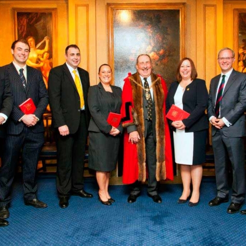 Over A Barrel! T & R Theakston Ltd Cooper Jonathan Manby (third from left) after being invested into the livery by Ian Frood, Master of the Worshipful Company of Coopers