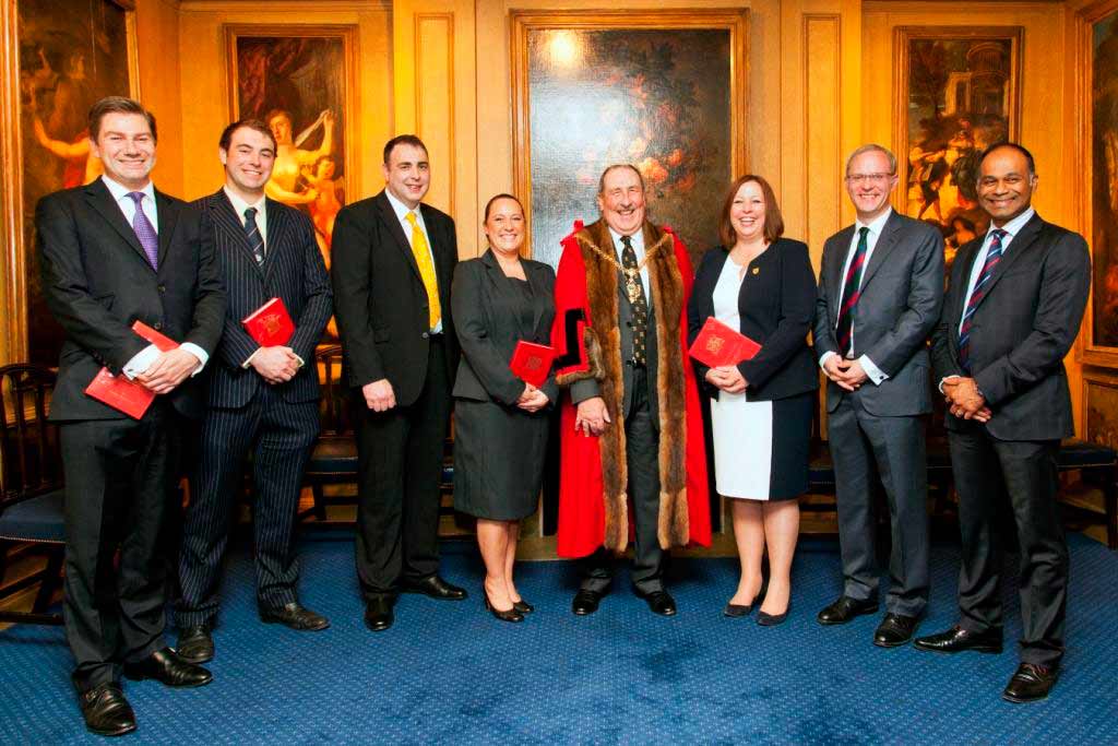 Over A Barrel! T & R Theakston Ltd Cooper Jonathan Manby (third from left) after being invested into the livery by Ian Frood, Master of the Worshipful Company of Coopers