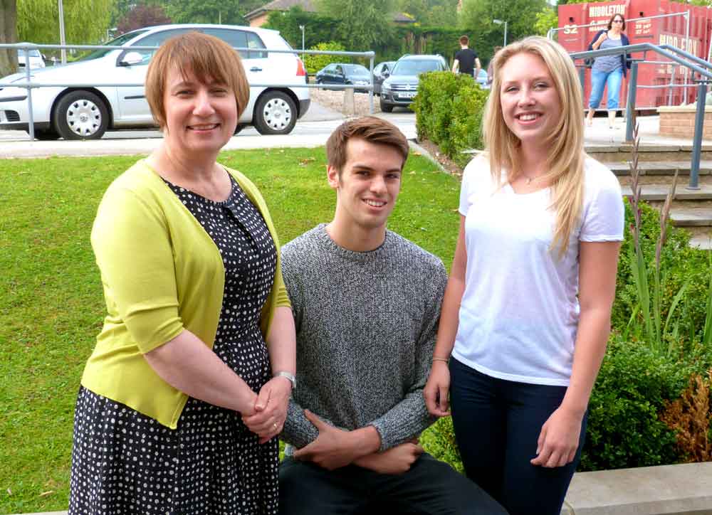 Head with Oliver and Sarah: Rossett Headteacher Helen Woodcock congratulates two of the school’s high-flying students, Oliver Bell and Sarah Littlejohn, who will be studying Maths at Warwick and Physics at Oxford respectively