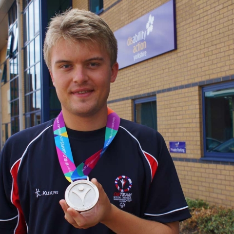 Olympic Silver Medalist! Disability Action Yorkshire apprentice James Parker proudly displays the silver medal he won at the Special Olympics World Games, held in Los Angeles