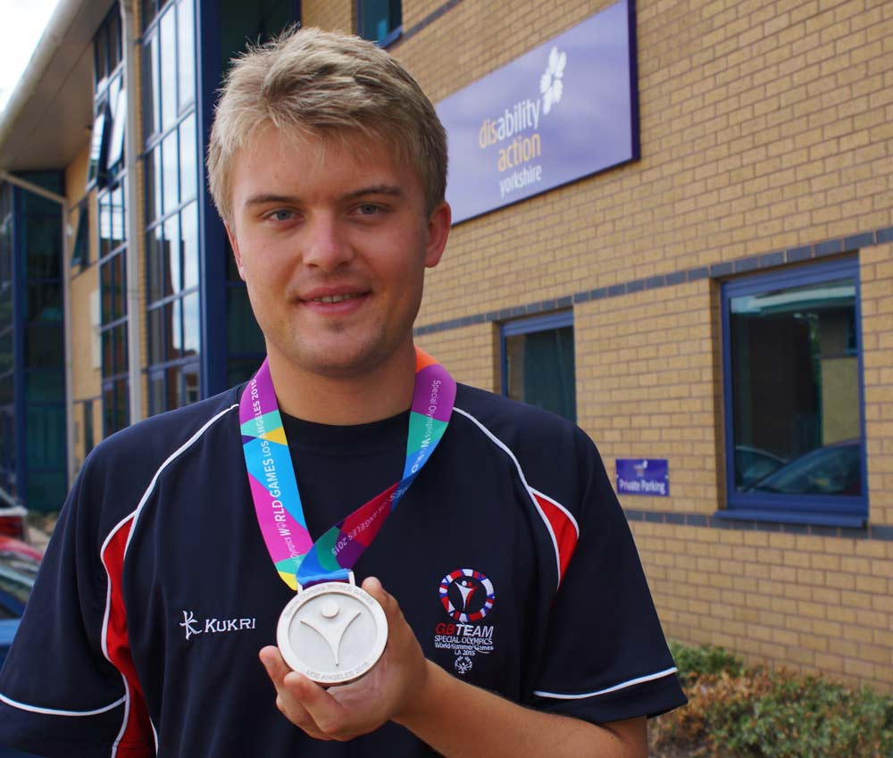Olympic Silver Medalist! Disability Action Yorkshire apprentice James Parker proudly displays the silver medal he won at the Special Olympics World Games, held in Los Angeles