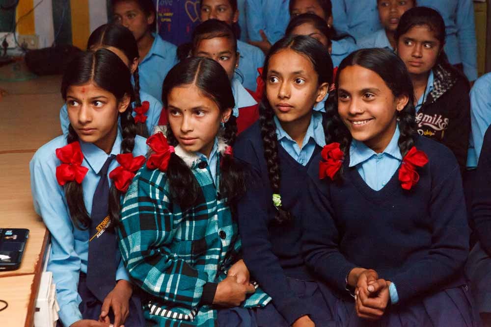 Year 8 girls at Shree Tri Shahid Higher Secondary School, Panchamul listen to a presentation by Rotarian Barry Pollard (Harrogate Brigantes Rotary Club) about a twinning project with Rossett School in Harrogate