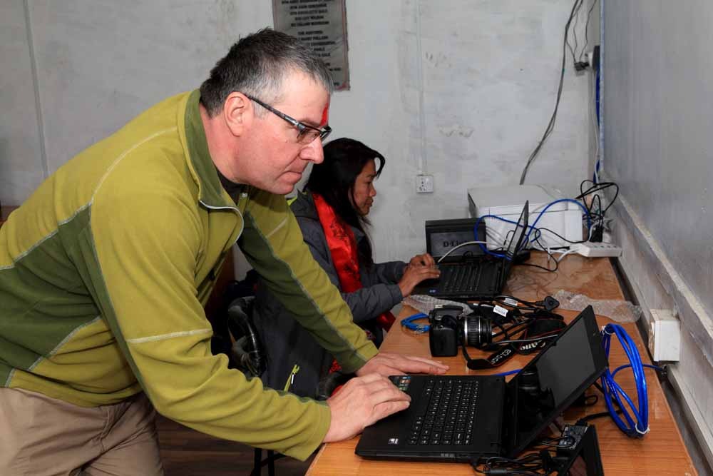 Rotarian Andy Morrison (Andisa IT) and local technician Mya Gurung (e-Networking) set up the IT network at Shree Jana Higher Secondary School, Rapakot