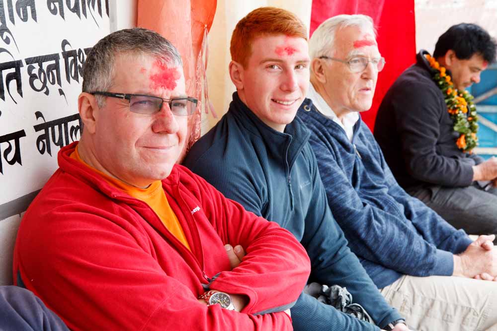 Former Rossett pupils, Andy and Callum Morrison, receive a traditional welcome at Aruchaur School