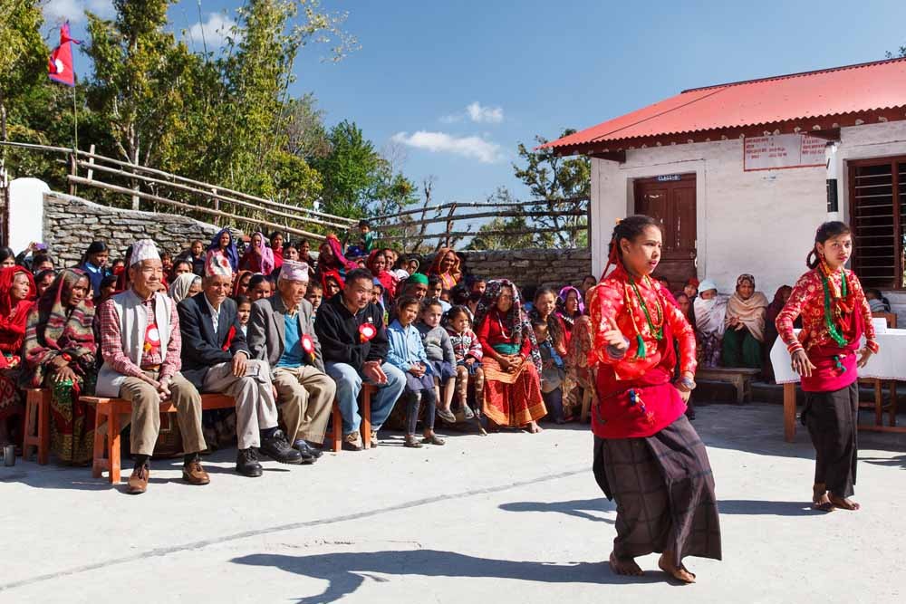 Children from Shree Gaun Pharka Lower Secondary school welcome visiting Rotarians with a traditional dance