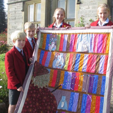 Year 6 pupils at Belmont Grosvenor School with their winning quilt, from left to right, Oscar Chary, Paul Atkinson, Matilda Tasker and Libby Wilson