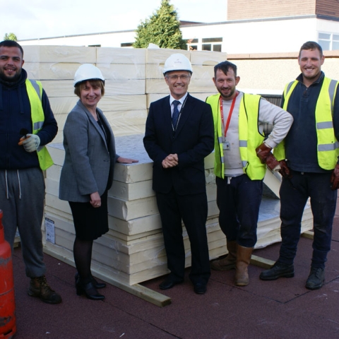Headteacher Helen Woodcock and Director of Finance Joe Joyce with contractors working on site at Rossett School.