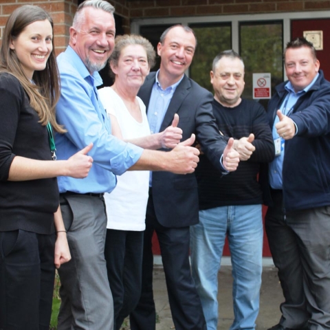 Kennion Court’s Jack Coote (second from right), his partner Karen Beardsmore (third from left) with Councillor Richard Cooper (centre) and the partnership team behind getting Jack onto mains gas