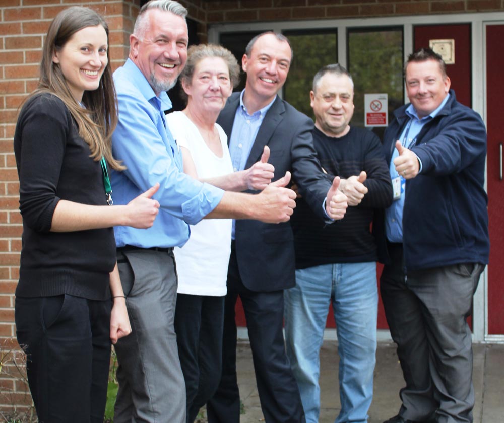 Kennion Court’s Jack Coote (second from right), his partner Karen Beardsmore (third from left) with Councillor Richard Cooper (centre) and the partnership team behind getting Jack onto mains gas