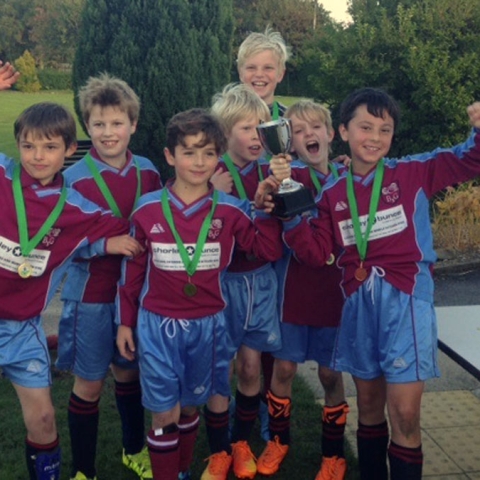 the winning U11 team with Head of Boys PE Chris Dight