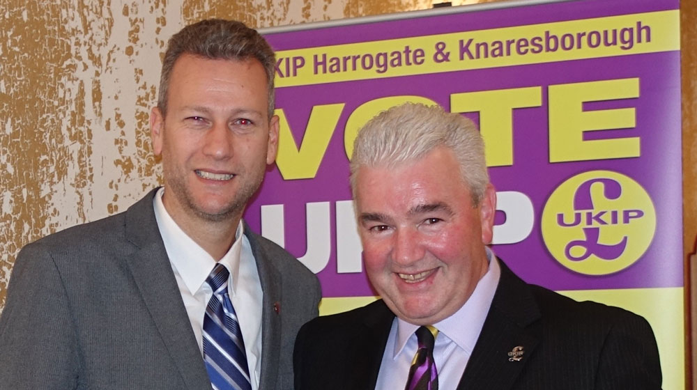 MEP Nathan Gill Speaks At UKIP’s Harrogate & Knaresborough Branch (for immediate release) The forthcoming referendum on the UK’s membership of the European Union was one of the topics covered by an MEP at a political meeting held in Harrogate. Nathan Gill, the UKIP MEP for Wales, was the guest speaker at the party’s Harrogate & Knaresborough branch meeting, held at the Ascot House Hotel. Mr Gill, who was born in East Yorkshire, told the audience how he first got involved in politics and of his subsequent election campaigns and going head to head in TV debates with Plaid Cymru leader, Leanne Wood. Last year, Mr Gill was made leader of the Party in Wales, and, next year, will be fighting for a seat in the Welsh Assembly. Alan Henderson, chairman of UKIP Harrogate & Knaresborough, said: “I would like to thank Nathan for taking the time out of his hectic schedule to attend our meeting. “His visit was very much appreciated by members and non member alike, and he gave a fascinating insight into the functions of the European Union and its wastefulness. “He also gave us his views on the EU referendum promised by David Cameron, and how, if the UK voted to leave, it would give other countries the strength to hold their own.” The meeting also heard from UKIP county councillor David Simister, who gave an update on the authority’s proposals to introduce parking charges in Harrogate town centre on a Sunday and evenings. Further details about the next meeting, which is being held on the evening of Thursday, December 10 at the Ascot House Hotel on Kings Road, Harrogate, are available on the branch’s website, http://www.ukipharrogate.org -ends- Pictured are: UKIP MEP Nathan Gill (left) and Alan Henderson, chairman of UKIP Harrogate & Knaresborough