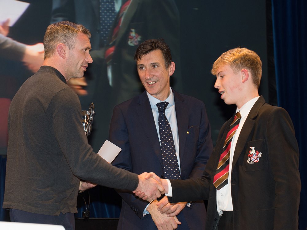 Jamie Peacock, with Headteacher Richard Sheriff presenting an award to a HGS student 