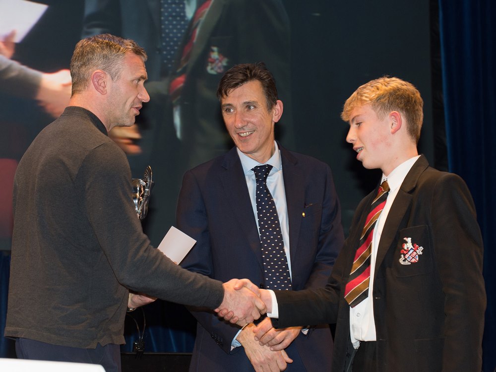 Jamie Peacock, with Headteacher Richard Sheriff presenting an award to a HGS student