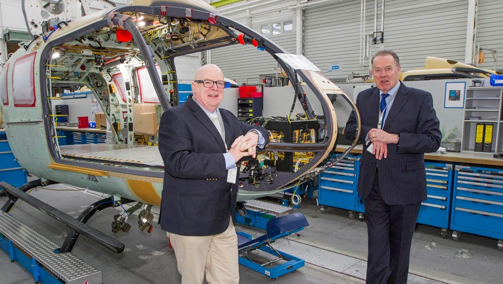 Bruce Burns, Vice-Chairman and Peter Sunderland, Chairman with the YAA’s first new H145 on the production line in Munich