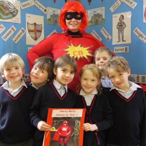 Mrs Nicola Shillam, AKA Superhero Cherry Berry and Year 1 pupils at Belmont Grosvenor School