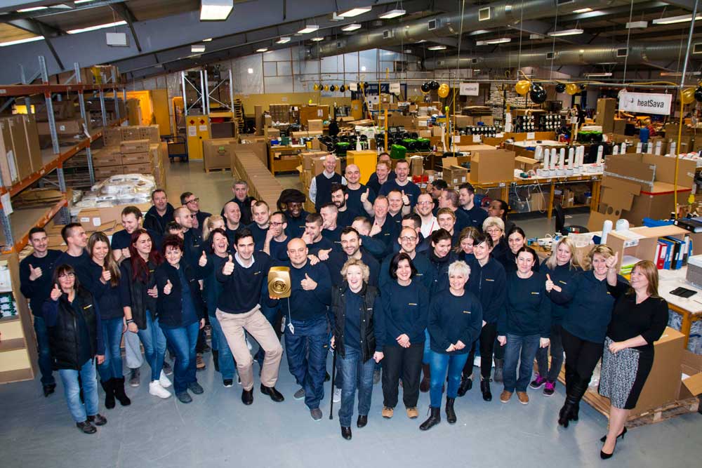 EnviroVent staff at the Harrogate factory with the one millionth golden fan they have produced to mark this special occasion
