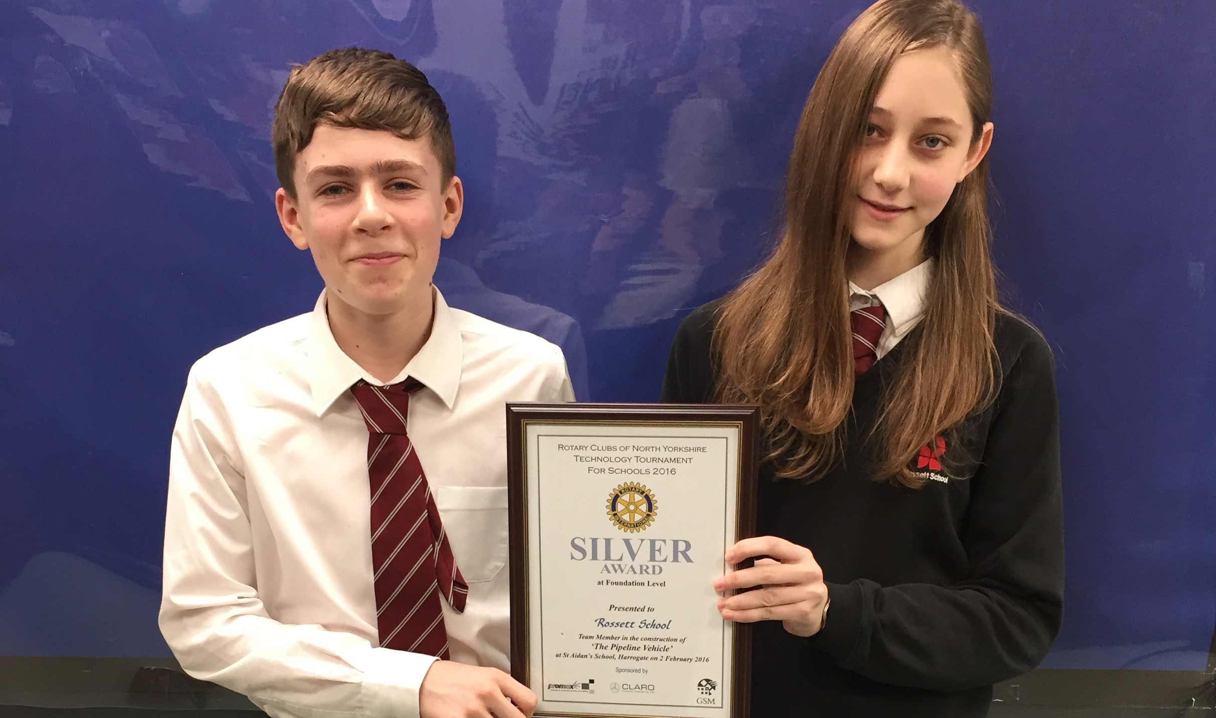 Rossett School students Adam Sherratt and Ellie Whitehead with their silver award at the Rotary Technology Competition