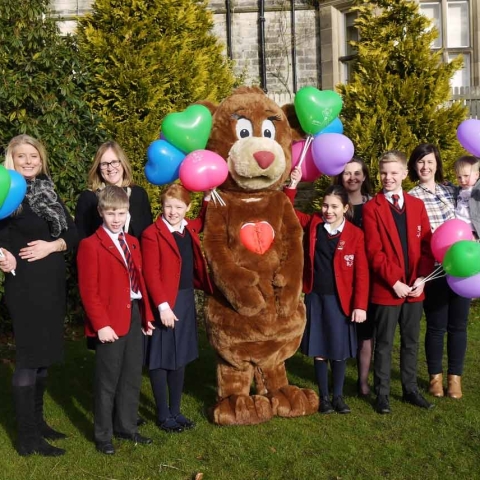 Myriam Barker from CHSF, Jack Hartley and Lottie Haggas, Nursery Assistant at Belmont Grosvenor School