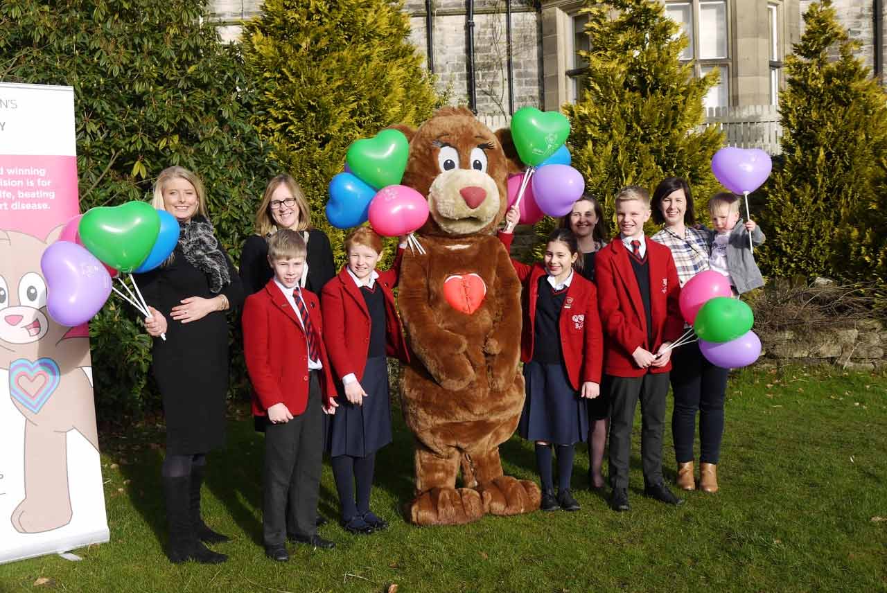 Myriam Barker from CHSF, Jack Hartley and Lottie Haggas, Nursery Assistant at Belmont Grosvenor School