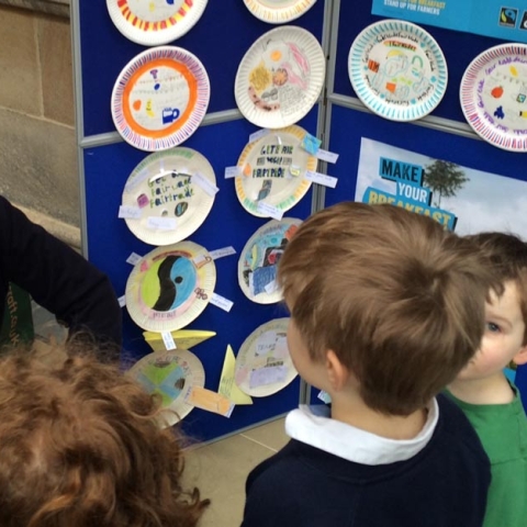 Andrew Jones MP with local schoolchildren and their display of Fairtrade breakfast plates