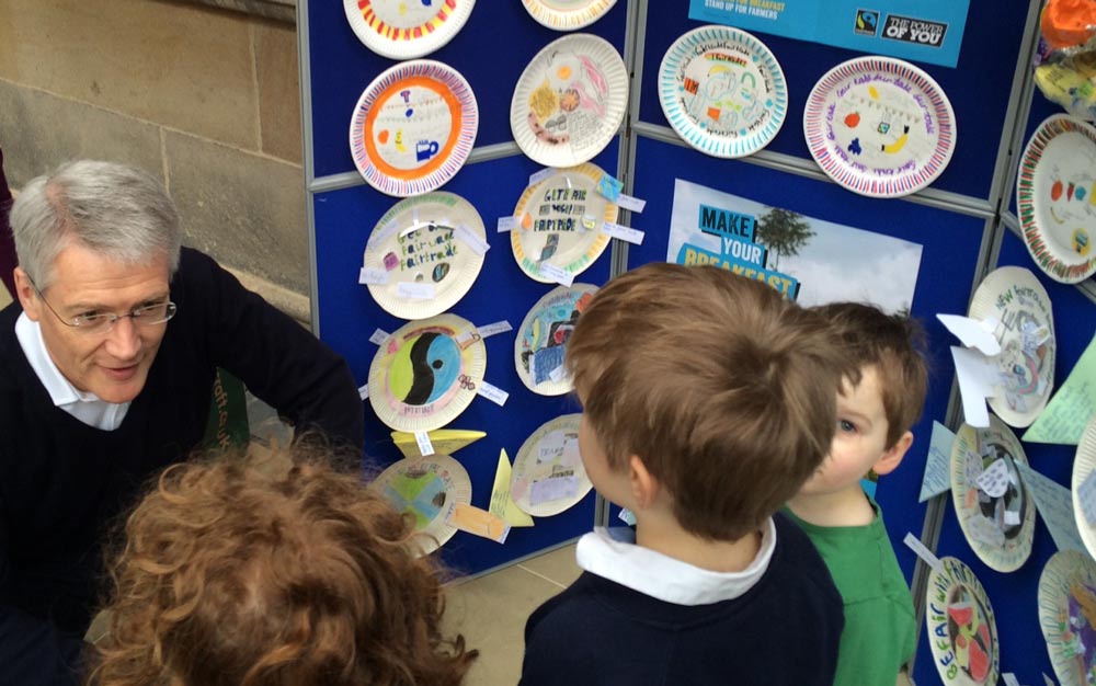 Andrew Jones MP with local schoolchildren and their display of Fairtrade breakfast plates