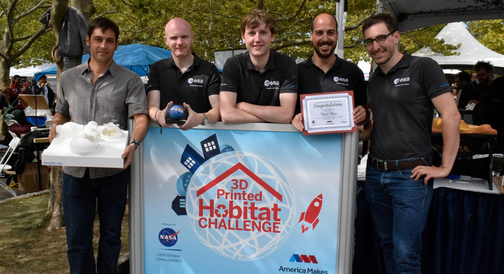 Leo Teeney (centre) and the team from ESA winning their award from NASA for LavaHive